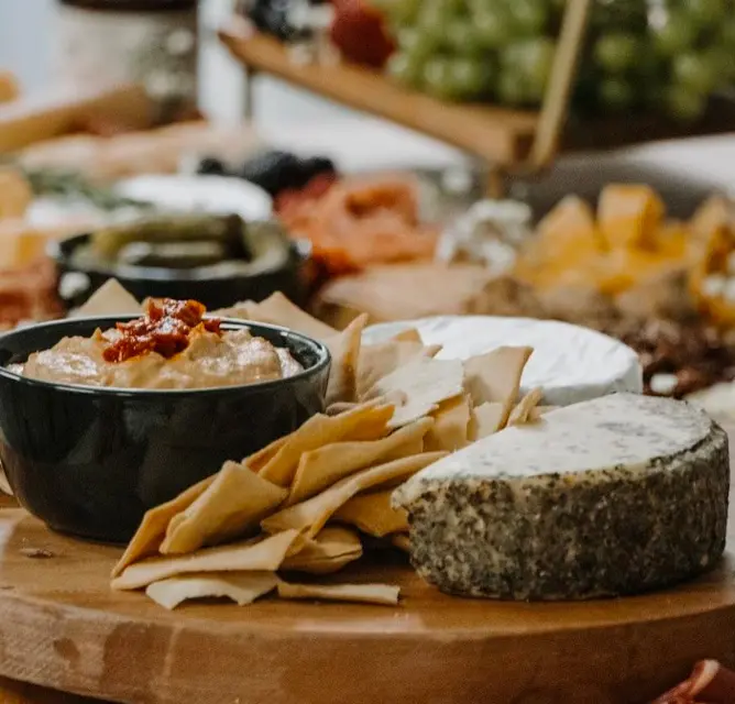 city-farms-charcuterie-grazing-table-close-up-of-cheese